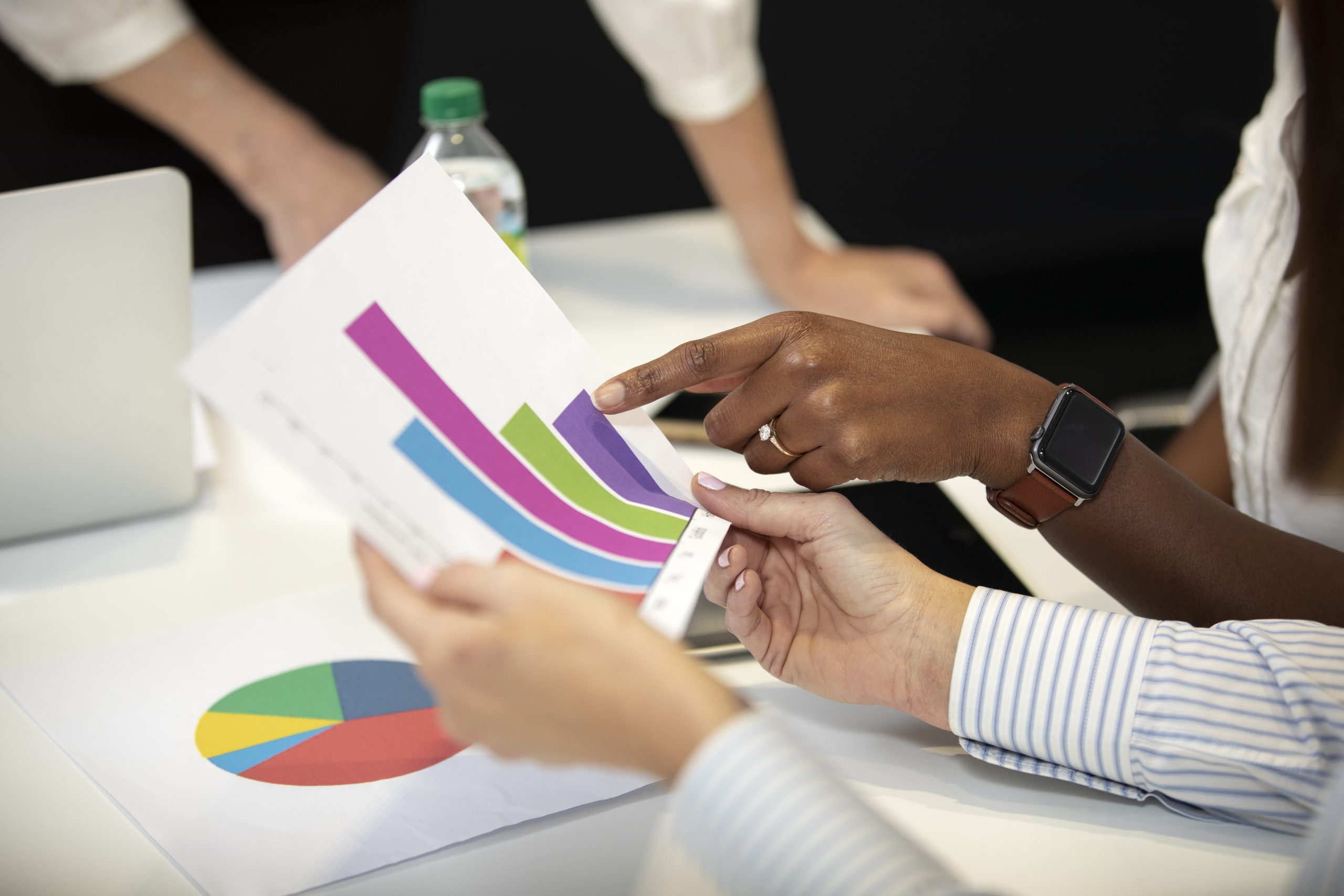 hands-holding-business-statistics-high-angle